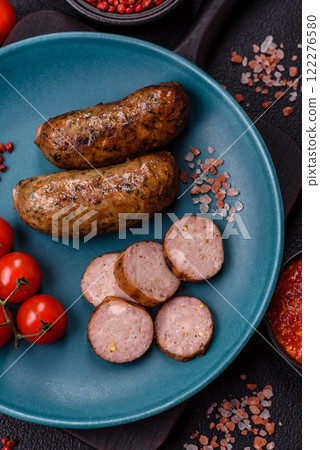 Juicy sausages with salt, spices and herbs 122276580