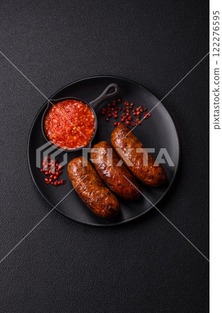 Juicy sausages with salt, spices and herbs Juicy sausages with salt, spices and herbs 122276595