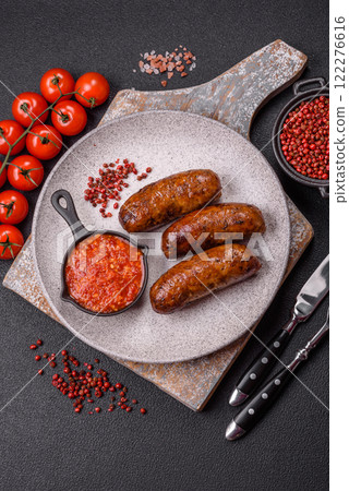 Juicy sausages with salt, spices and herbs 122276616