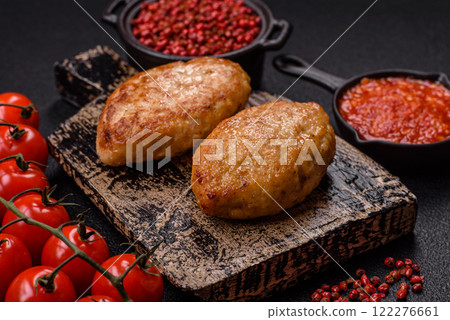 Delicious fresh fried minced fish cutlets with spices and herbs Delicious fresh fried minced fish cutlets with spices and herbs 122276661