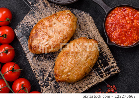 Delicious fresh fried minced fish cutlets with spices and herbs Delicious fresh fried minced fish cutlets with spices and herbs 122276662