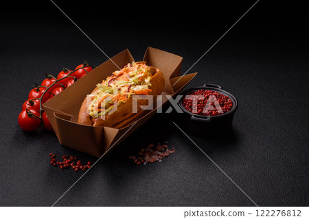 Hotdog with grilled sausage with cabbage, carrots and onions Hotdog with grilled sausage with cabbage, carrots and onions 122276812