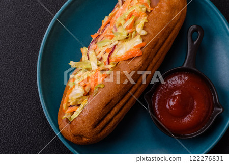 Hotdog with grilled sausage with cabbage, carrots and onions 122276831