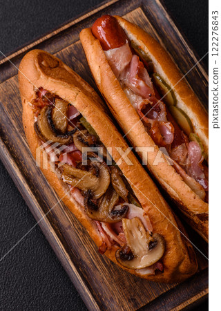 Hotdog with grilled sausage with bacon and mushrooms 122276843