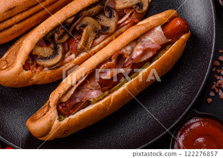 Hotdog with grilled sausage with bacon and mushrooms Hotdog with grilled sausage with bacon and mushrooms 122276857