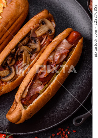 Hotdog with grilled sausage with bacon and mushrooms Hotdog with grilled sausage with bacon and mushrooms 122276858