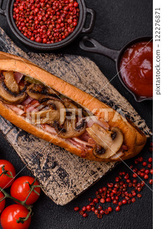 Hotdog with grilled sausage with bacon and mushrooms 122276871