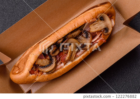 Hotdog with grilled sausage with bacon and mushrooms 122276882