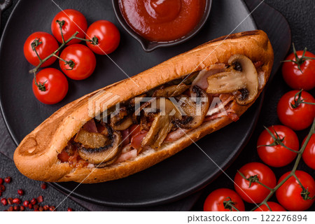 Hotdog with grilled sausage with bacon and mushrooms 122276894