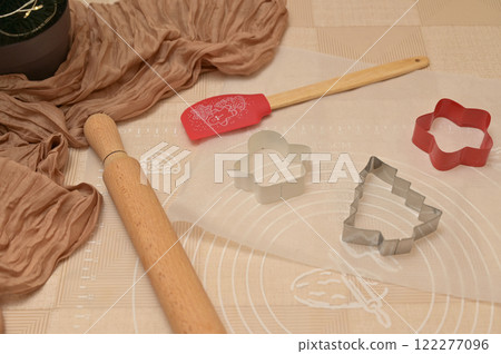 Christmas homemade baking, shaped cutter for baking, silicone spatula and rolling pin on the table 122277096