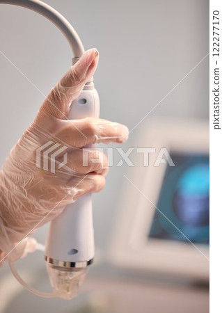 A man is currently undergoing a specialized facial treatment within a serene spa setting A man is currently undergoing a specialized facial treatment within a serene spa setting 122277170