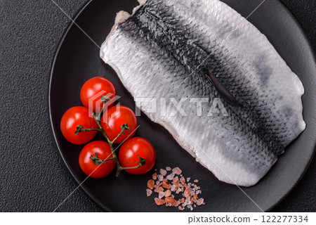 Herring fillet salted and marinated with salt, spices and oil 122277334