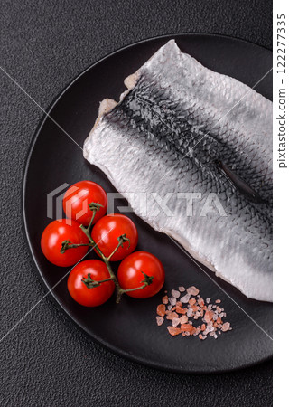 Herring fillet salted and marinated with salt, spices and oil Herring fillet salted and marinated with salt, spices and oil 122277335