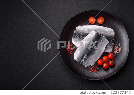 Herring fillet salted and marinated with salt, spices and oil Herring fillet salted and marinated with salt, spices and oil 122277343