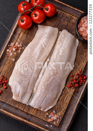Herring fillet salted and marinated with salt, spices and oil Herring fillet salted and marinated with salt, spices and oil 122277359
