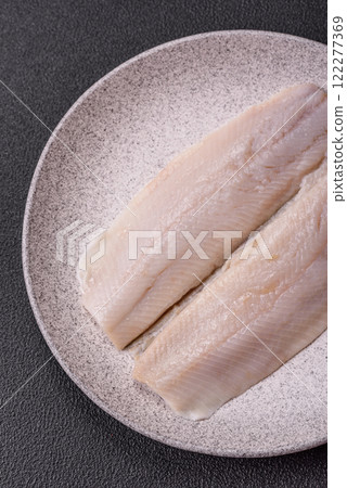 Herring fillet salted and marinated with salt, spices and oil 122277369
