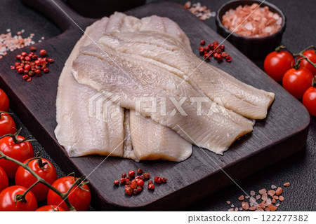 Herring fillet salted and marinated with salt, spices and oil 122277382