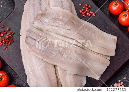 Herring fillet salted and marinated with salt, spices and oil 122277383