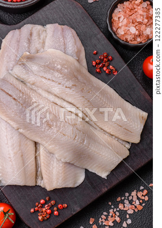 Herring fillet salted and marinated with salt, spices and oil 122277385