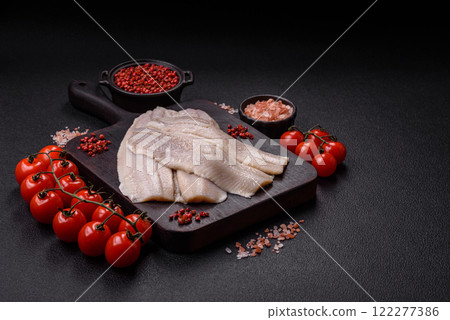 Herring fillet salted and marinated with salt, spices and oil Herring fillet salted and marinated with salt, spices and oil 122277386
