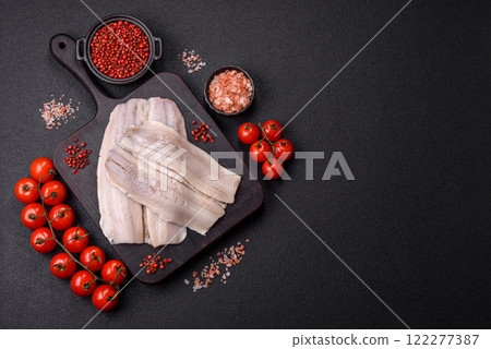Herring fillet salted and marinated with salt, spices and oil Herring fillet salted and marinated with salt, spices and oil 122277387