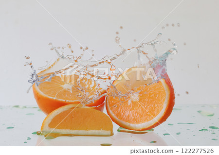 Orange and splashes Orange and splashes 122277526