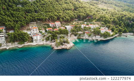 Adriatic Sea with amazing turquoise clean water and white sand. Aerial view of Brela beach, Croatia. 122277974