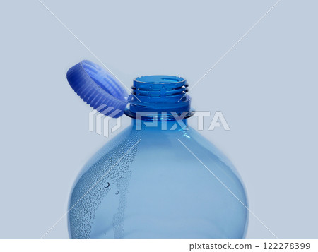 A new mechanism of plastic bottle with a stationary fixed tethered cap. Blue plastic PET water bottle with cup open close up isolated on white. Recycling, environment friendly and ecology concept A new mechanism of plastic bottle with a stationary fixed tethered cap. Blue plastic PET water bottle with cup open close up isolated on white. Recycling, environment friendly and ecology concept 122278399