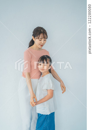Mom and her 9 year old daughter 122280080