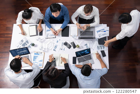 Analyst team utilizing BI Fintech to analyze financial data at table. Prudent Analyst team utilizing BI Fintech to analyze financial data at table. Prudent 122280547