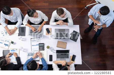 Analyst team utilizing BI Fintech to analyze financial data at table. Prudent Analyst team utilizing BI Fintech to analyze financial data at table. Prudent 122280581