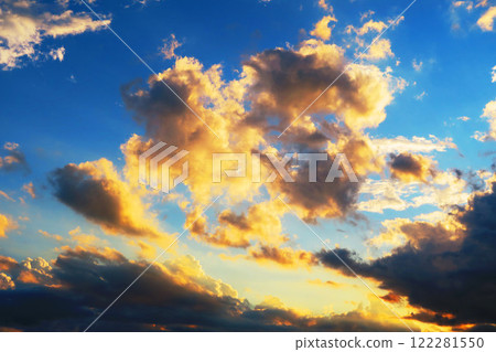 A powerful cloudscape of the evening sky with dark clouds spreading out A powerful cloudscape of the evening sky with dark clouds spreading out 122281550