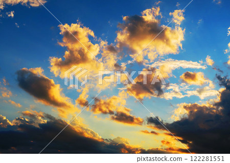 A powerful cloudscape of the evening sky with dark clouds spreading out A powerful cloudscape of the evening sky with dark clouds spreading out 122281551