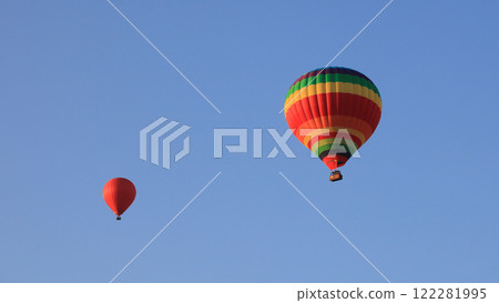Two colorful balloons over Vang Vieng, Laos. 122281995