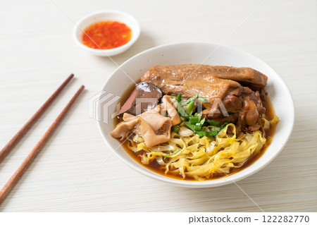 egg noodles with stewed and braised duck in brown soup egg noodles with stewed and braised duck in brown soup 122282770