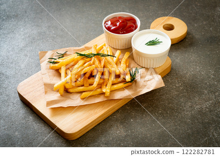 French fries with sour cream and ketchup 122282781