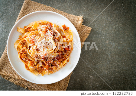 Homemade pasta fettuccine bolognese with cheese Homemade pasta fettuccine bolognese with cheese 122282783