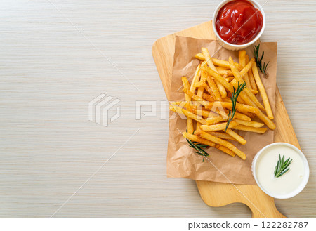 French fries with sour cream and ketchup 122282787