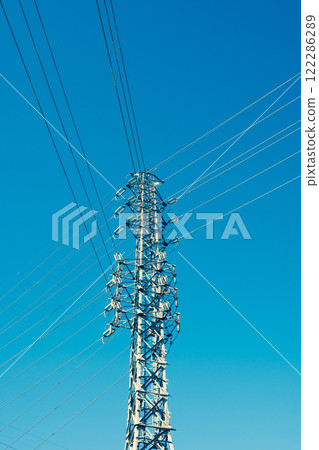 A power transmission tower towering in a clear blue sky b-3 Emphasis on warm and cool colors A power transmission tower towering in a clear blue sky b-3 Emphasis on warm and cool colors 122286289