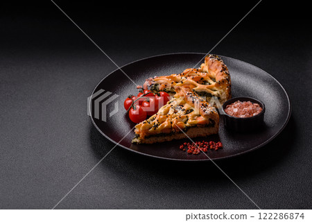 Pieces of quiche with salmon, spinach or broccoli, salt and spices Pieces of quiche with salmon, spinach or broccoli, salt and spices 122286874