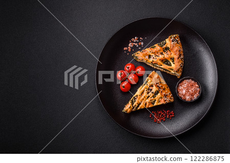 Pieces of quiche with salmon, spinach or broccoli, salt and spices 122286875