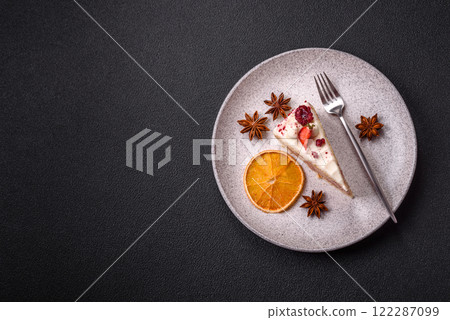 Piece of sweet layer cake with white cream, raspberries and strawberries 122287099