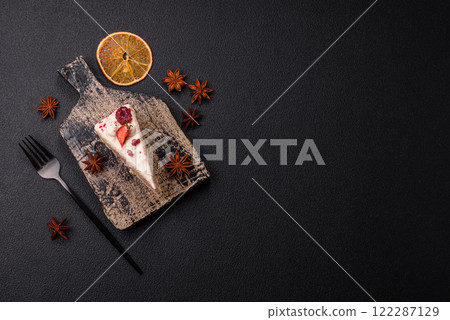Piece of sweet layer cake with white cream, raspberries and strawberries 122287129