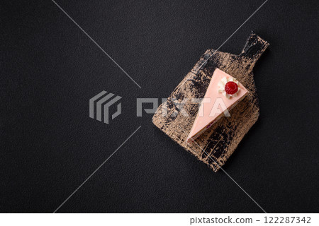 Piece of sweet cake with pink cream with raspberry flavor, with shortbread, cheesecake Piece of sweet cake with pink cream with raspberry flavor, with shortbread, cheesecake 122287342
