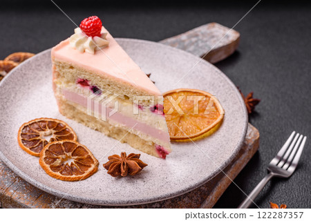 Piece of sweet cake with pink cream with raspberry flavor, with shortbread, cheesecake Piece of sweet cake with pink cream with raspberry flavor, with shortbread, cheesecake 122287357