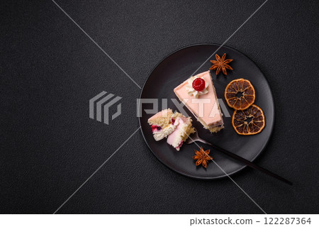 Piece of sweet cake with pink cream with raspberry flavor, with shortbread, cheesecake 122287364
