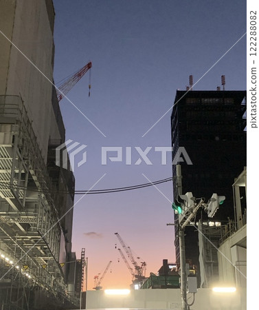 Crane at a construction site at dusk Crane at a construction site at dusk 122288082