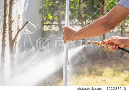 air conditioning filter cleaning with water spray 122288240