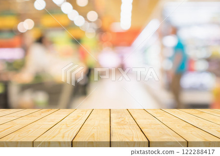 Empty wood table top with supermarket blurred background for product display Empty wood table top with supermarket blurred background for product display 122288417