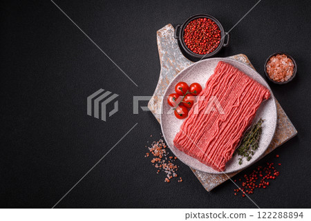 Raw ground beef or pork with salt, spices, herbs and tomatoes Raw ground beef or pork with salt, spices, herbs and tomatoes 122288894